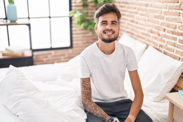 Young Hispanic Man Smiling Confident Sitting Bed Bedroom — Stockfoto
