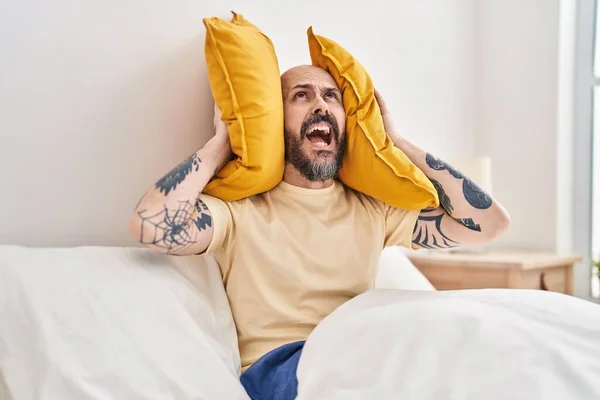 Young Bald Man Covering Ears Noise Bedroom — Stock Photo, Image