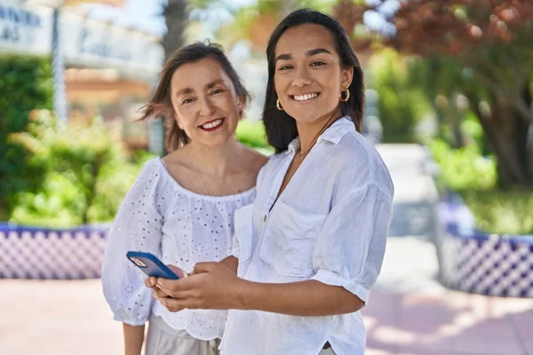 Two Women Mother Daughter Smiling Confident Using Smartphone Park — Photo