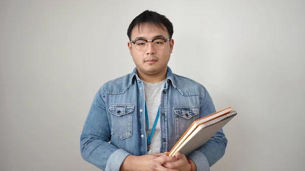 Mladý Číňan Muž Drží Knihy Přes Izolované Bílé Pozadí — Stock fotografie