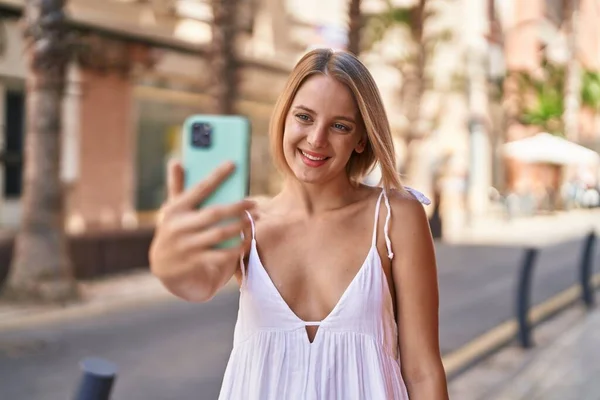 Young Blonde Woman Smiling Confident Making Selfie Smartphone Street — стоковое фото