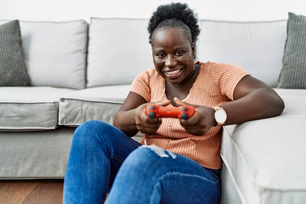 Young African American Woman Playing Video Game Sitting Floor Home — Stock fotografie