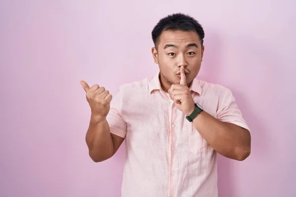 Chinese Young Man Standing Pink Background Asking Quiet Finger Lips — Stock Photo, Image