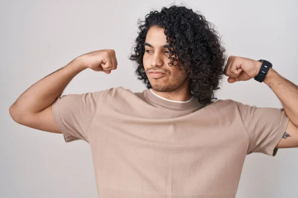 Hispanic Man Curly Hair Standing White Background Showing Arms Muscles — Stock Photo, Image