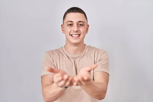 Young Man Standing Isolated Background Smiling Hands Palms Together Receiving — Foto de Stock