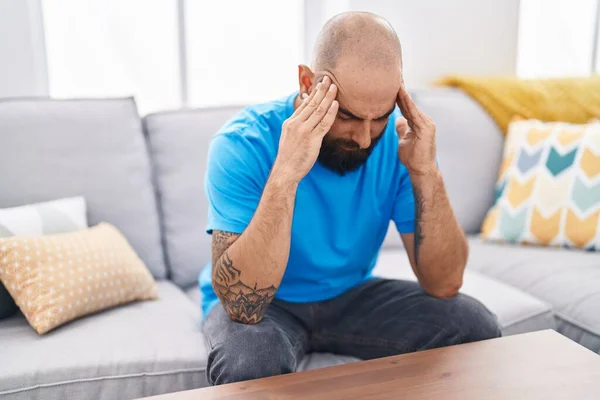 Young Bald Man Stressed Sitting Sofa Home — Stok fotoğraf
