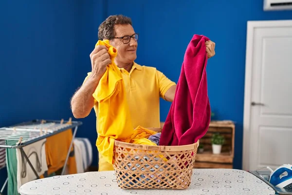 Middle Age Man Smiling Confident Holding Clothes Basket Laundry Room — Fotografia de Stock