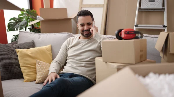 Young Hispanic Man Smiling Confident Talking Smartphone New Home — Fotografia de Stock