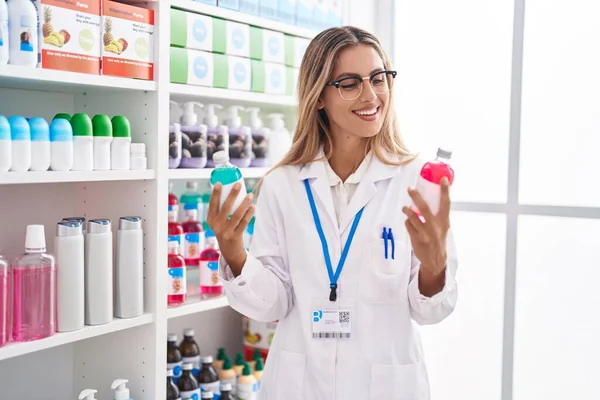 Young Blonde Woman Pharmacist Smiling Confident Holding Medication Bottles Pharmacy — Stock Photo, Image