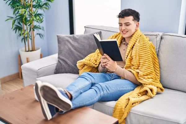 Young Non Binary Man Reading Book Sitting Sofa Home — Photo