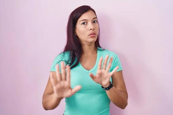 Young Hispanic Woman Standing Pink Background Moving Away Hands Palms — Stockfoto