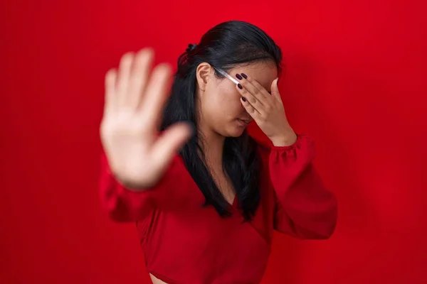 Asian Young Woman Standing Red Background Covering Eyes Hands Doing — Stock Photo, Image