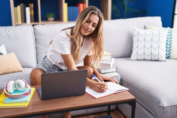 Young Blonde Woman Student Sitting Sofa Writing Notebook Home — 图库照片