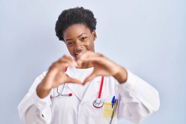 African American Woman Wearing Doctor Uniform Stethoscope Smiling Love Showing — Stock Photo, Image