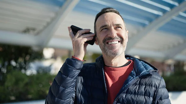 Middle Age Man Smiling Confident Listening Voice Message Smartphone Park — Fotografia de Stock