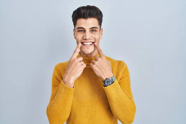 Young Hispanic Man Standing Blue Background Smiling Open Mouth Fingers — Photo