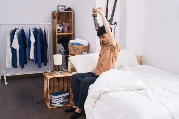 Young Hispanic Man Waking Stretching Arms Bedroom — 图库照片