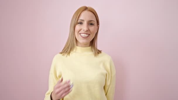 Young Blonde Woman Blowing Kiss Hand Isolated Pink Background — Stockvideo