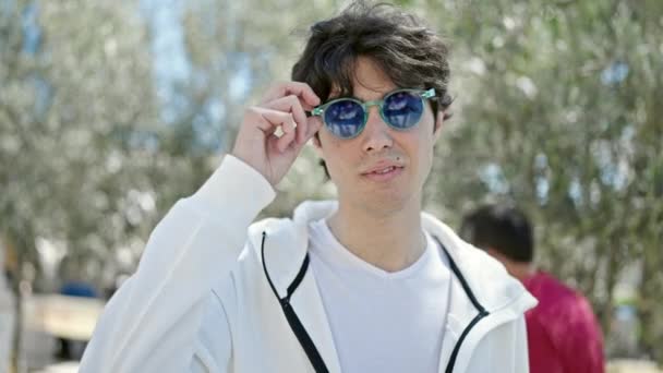 Young Hispanic Man Smiling Confident Wearing Sunglasses Park — Vídeos de Stock