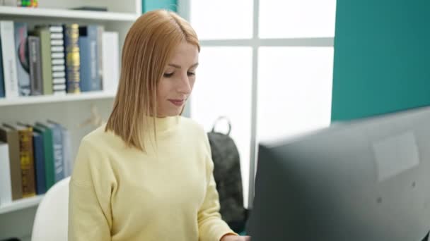 Young Blonde Woman Student Using Computer Studying University Classroom — Stok video