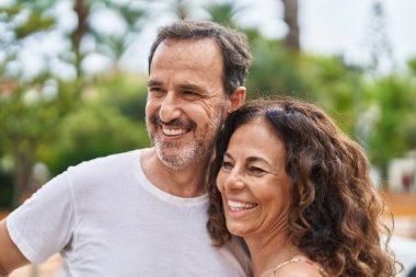 Man and woman couple smiling confident standing together at park