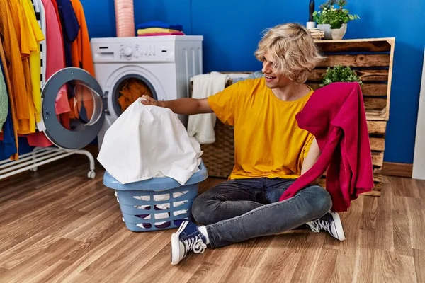 Young Blond Man Smiling Confident Washing Clothes Laundry Room — Stock fotografie