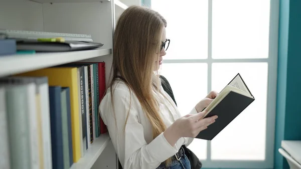 Young Blonde Woman Student Standing Reading Book University Classroom — Foto Stock