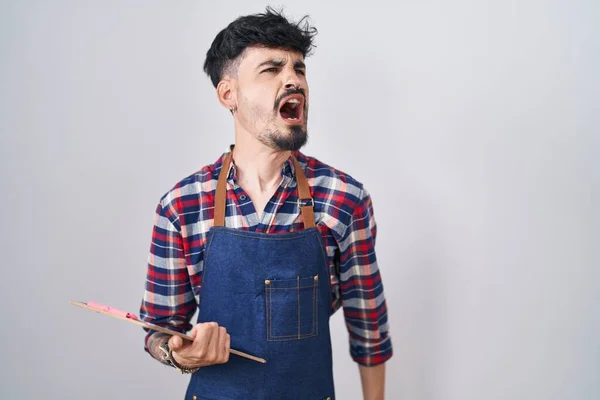 Young Hispanic Man Beard Wearing Waiter Apron Holding Clipboard Angry — Stock Photo, Image