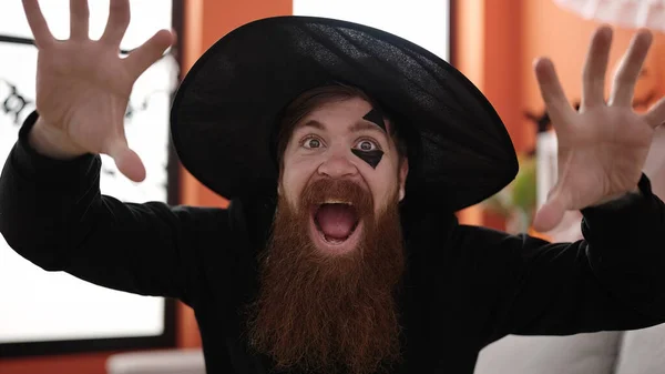 Young Redhead Man Wearing Wizard Costume Doing Scare Expression Home — Stockfoto