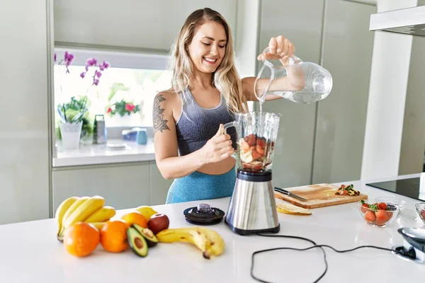 Young Woman Smiling Confident Pouring Water Blender Kitchen — Stockfoto