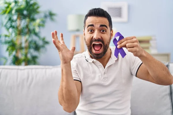 Young Hispanic Man Beard Holding Purple Ribbon Awareness Celebrating Victory — Stock Photo, Image