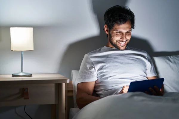 Young Hispanic Man Using Touchpad Sitting Bed Bedroom — Fotografia de Stock