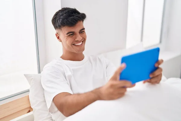 Young Hispanic Man Using Touchpad Sitting Bed Bedroom — Foto de Stock