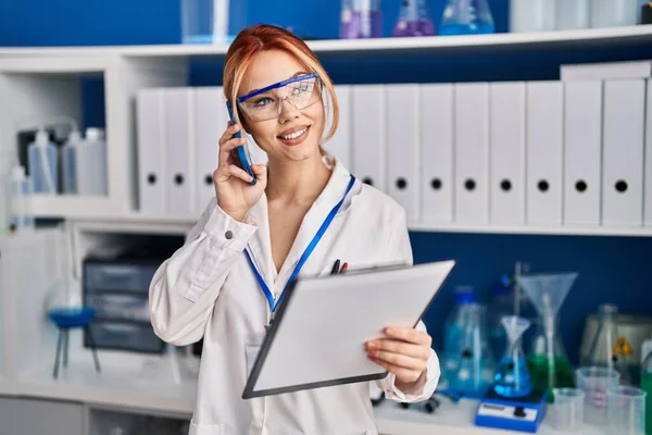 Young Caucasian Woman Scientist Talking Smartphone Reading Document Laboratory — Stock Photo, Image