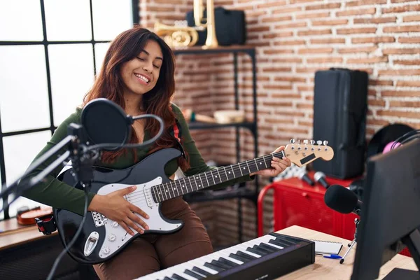 Young Hispanic Woman Artist Playing Electrical Guitar Music Studio — Stok fotoğraf
