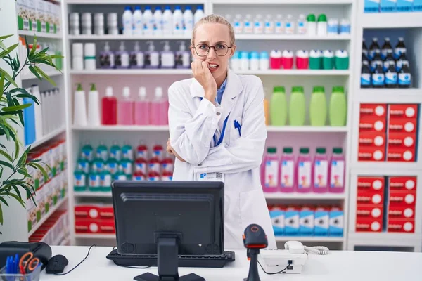 Young Caucasian Woman Working Pharmacy Drugstore Looking Stressed Nervous Hands — ストック写真