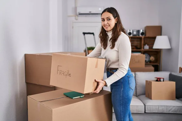 Young Beautiful Hispanic Woman Smiling Confident Holding Fragile Package New — Foto de Stock