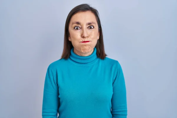 Middle Age Hispanic Woman Standing Isolated Background Puffing Cheeks Funny — Zdjęcie stockowe