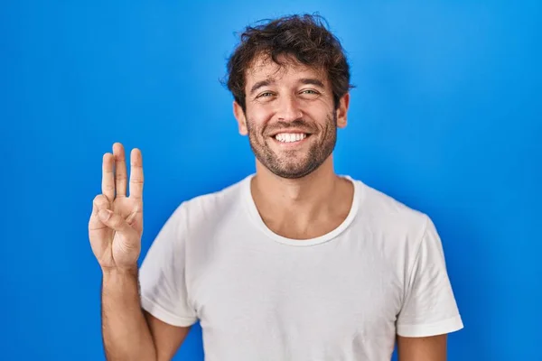 Hispanic Young Man Standing Blue Background Showing Pointing Fingers Number — Stockfoto