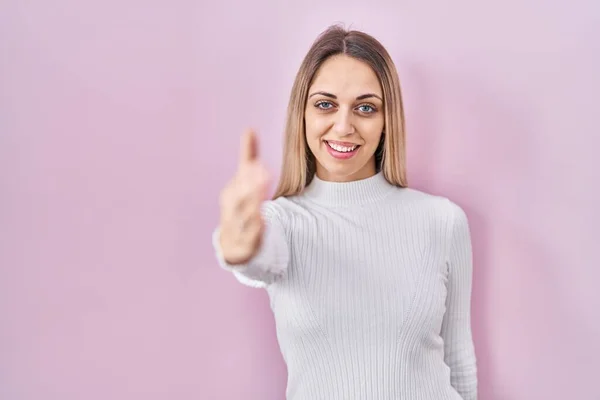 Young Blonde Woman Wearing White Sweater Pink Background Smiling Friendly — Stock Photo, Image