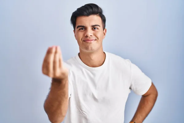 Hispanic Man Standing Blue Background Doing Italian Gesture Hand Fingers — 图库照片