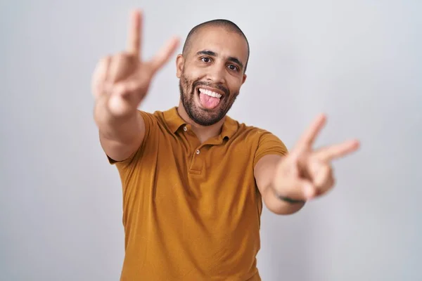 Hispanic Man Beard Standing White Background Smiling Tongue Out Showing — Stock fotografie