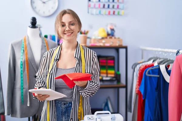 Young Blonde Woman Tailor Smiling Confident Holding Cloths Tailor Shop — Stock Photo, Image