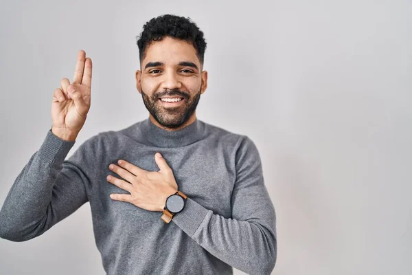 Hispanic Man Beard Standing White Background Smiling Swearing Hand Chest — Stok fotoğraf