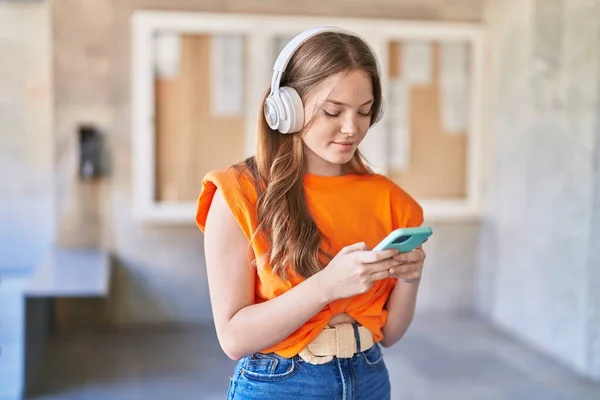 stock image Young woman smiling confident listening to music at university