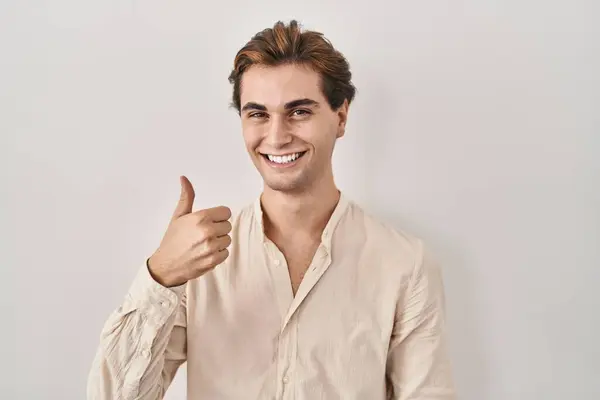 Young Man Standing Isolated Background Doing Happy Thumbs Gesture Hand — Stock Photo, Image