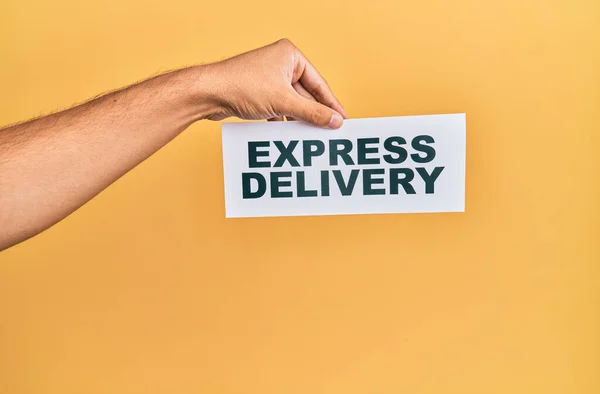 Hand Caucasian Man Holding Paper Delivery Express Message Isolated Yellow — Stock Photo, Image