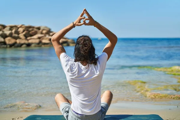 Young Hispanic Man Doing Yoga Exercise Sitting Sand Beach — 图库照片