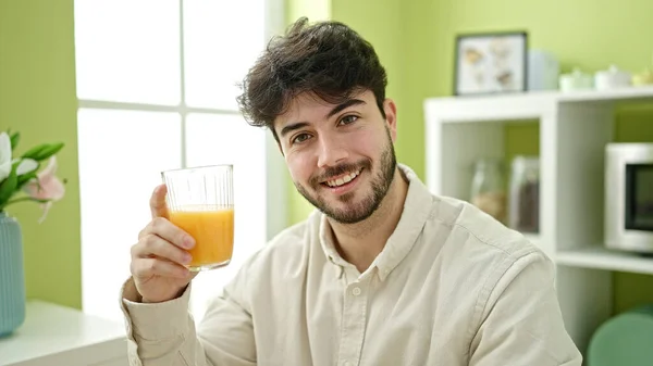 Young Hispanic Man Holding Glass Orange Juice Dinning Room — Stock Photo, Image