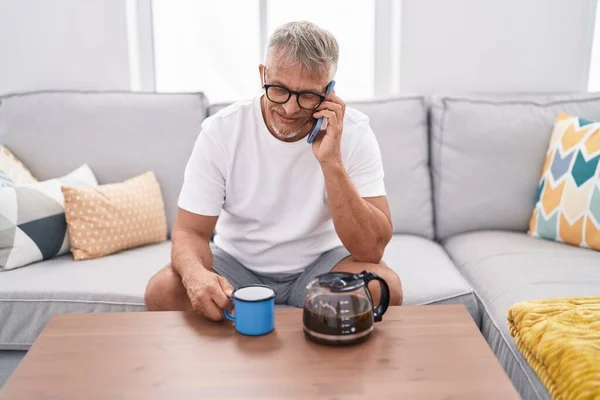 Middle Age Grey Haired Man Drinking Coffee Talking Smartphone Home — Stock fotografie